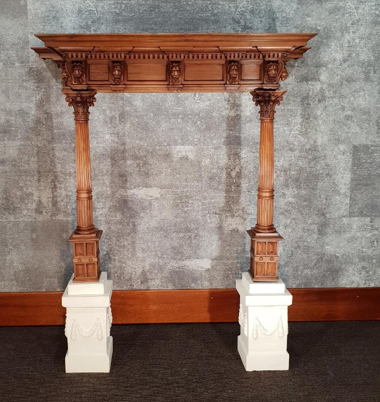 Antique walnut fireplace with grotesque lions heads
